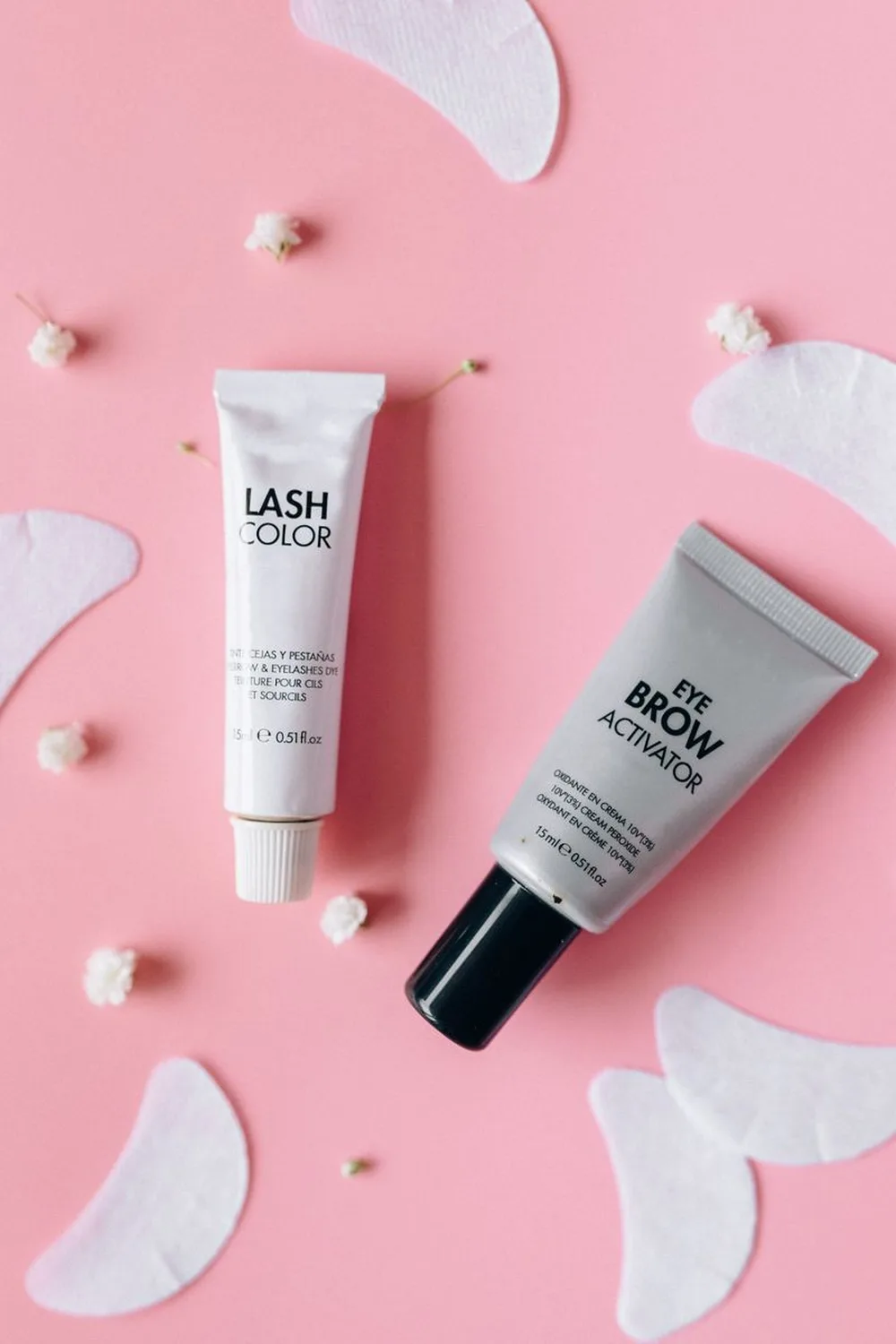 Flat lay of eyebrow gel product tubes